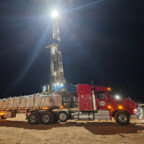 A North Point truck on a rig location at night