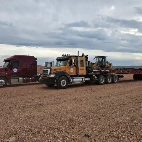 North Point trucks and a loaded stepdeck at the yard