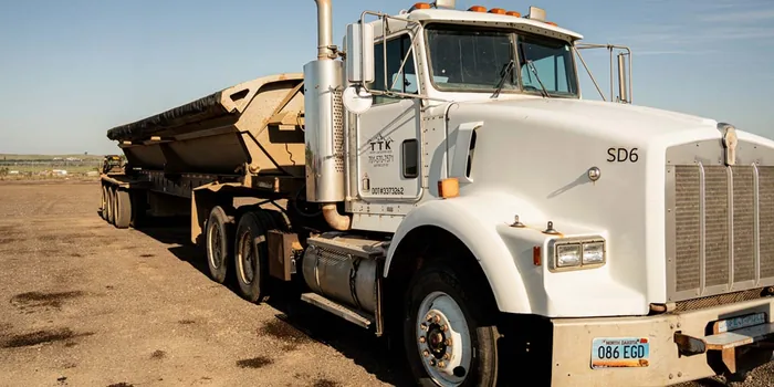 A TTK side dump truck and trailer